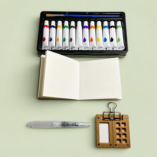 Contenu du kit aquarelle Encre & Silence : 12 tubes de peinture et palette en bois